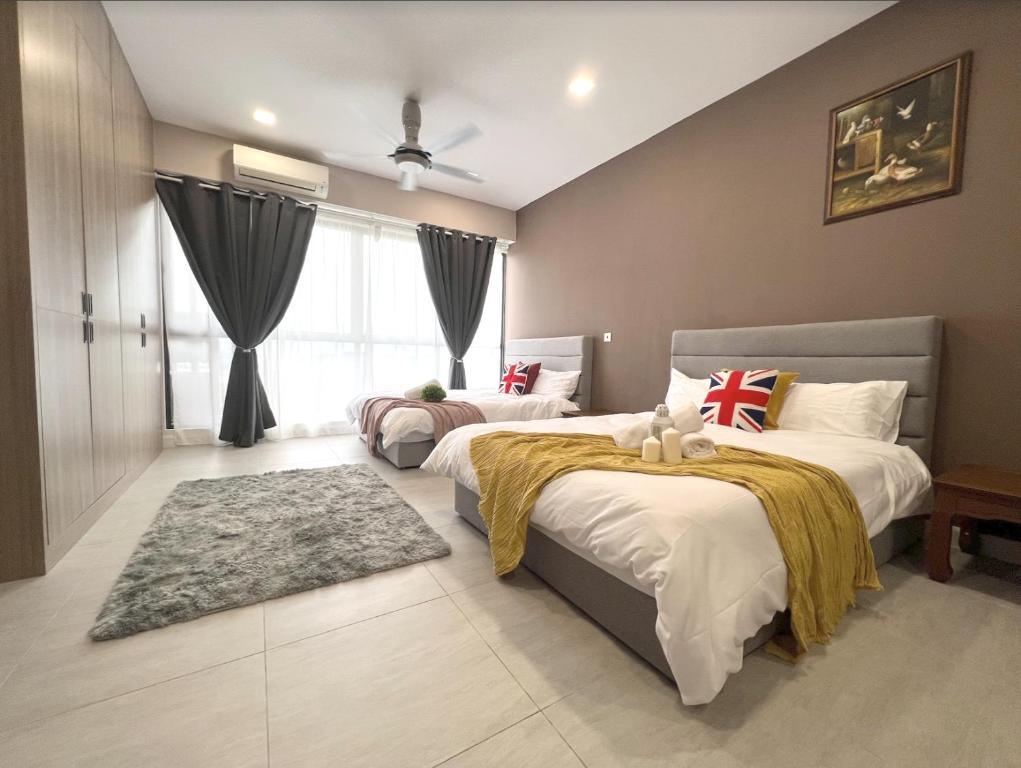 a bedroom with two beds and a large window at BELLSUITE SEPANG NEAR KLIA Airport in Sepang