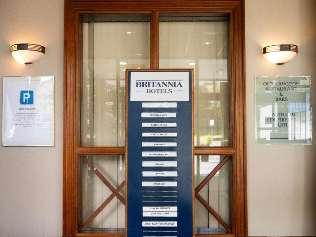 a sign in front of a window with a keyboard at Britannia Hotel Newcastle Airport in Newcastle upon Tyne