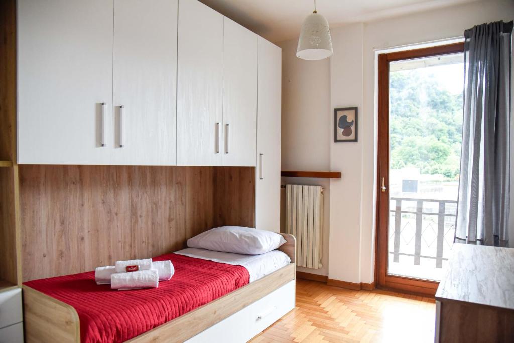 Postel nebo postele na pokoji v ubytování Appartamento Magnolia