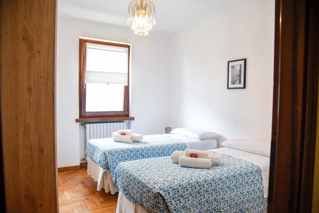 Postel nebo postele na pokoji v ubytování Appartamento Magnolia