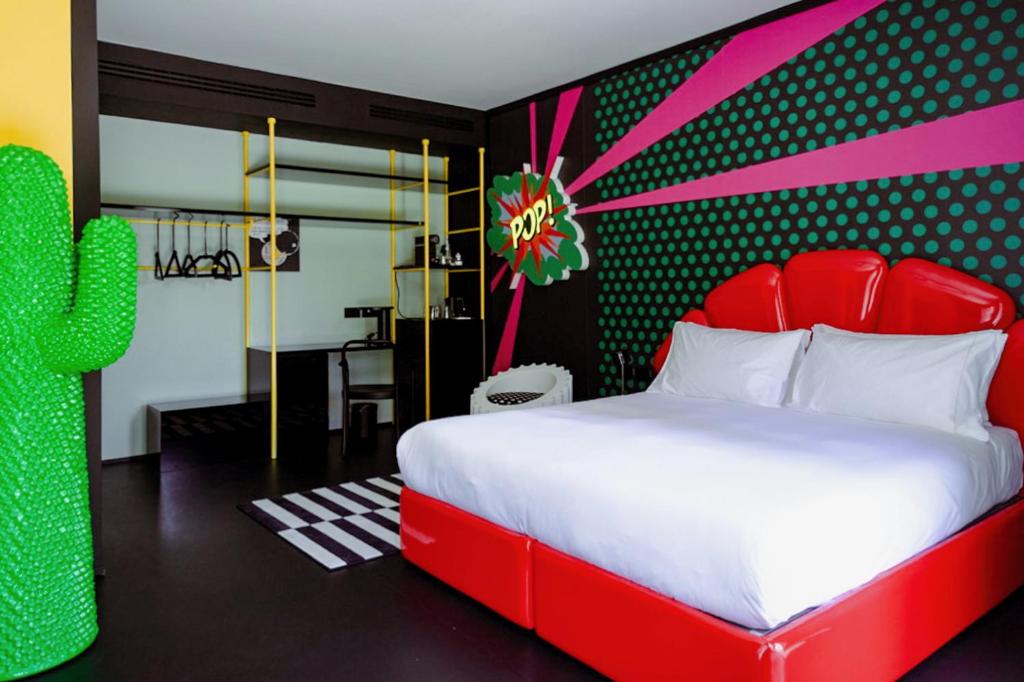 Postel nebo postele na pokoji v ubytování Interno Marche Design Experience Hotel