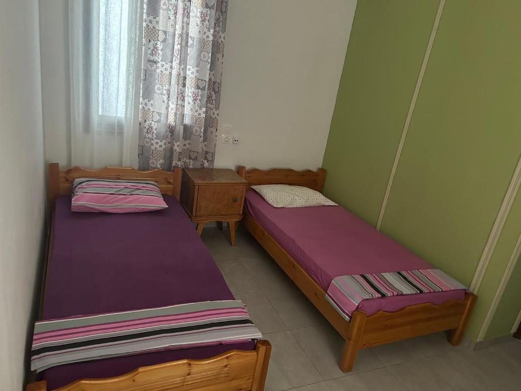 Postel nebo postele na pokoji v ubytování Lemonia