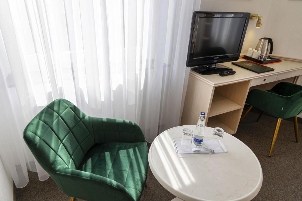 TV a/nebo společenská místnost v ubytování Hotel Brack