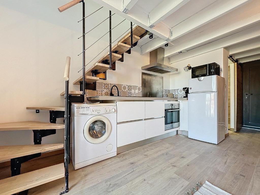 Kuchyň nebo kuchyňský kout v ubytování Appartement vue mer sur Port de Leucate Climatisé, Parking gratuit, Linges et Serviettes inclus