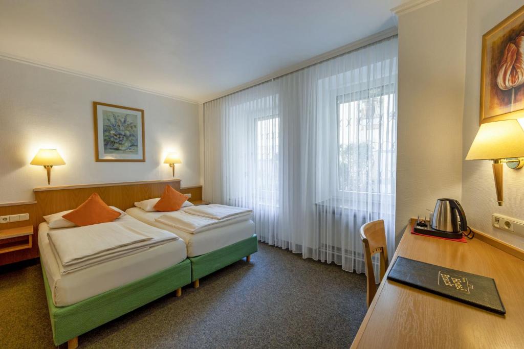 Postel nebo postele na pokoji v ubytování Hotel Brack