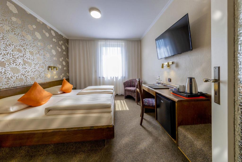 Postel nebo postele na pokoji v ubytování Hotel Brack
