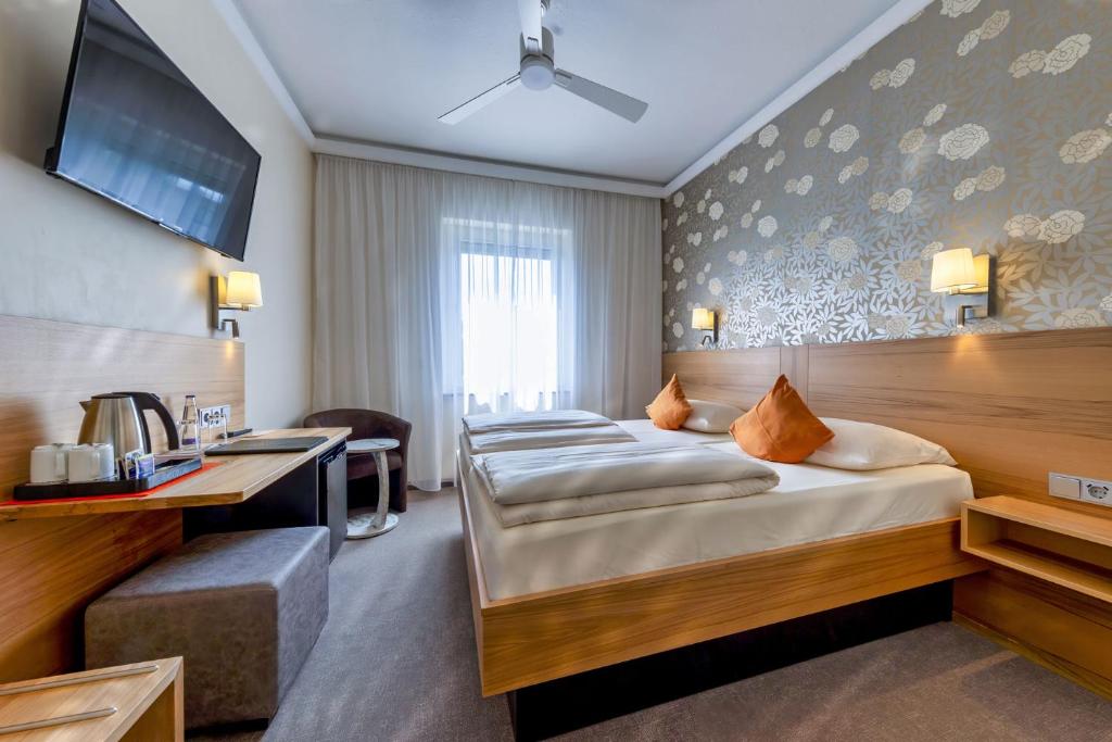 Postel nebo postele na pokoji v ubytování Hotel Brack