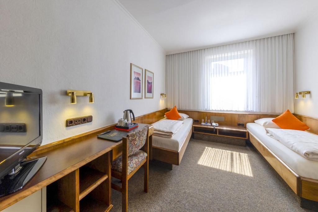 Postel nebo postele na pokoji v ubytování Hotel Brack