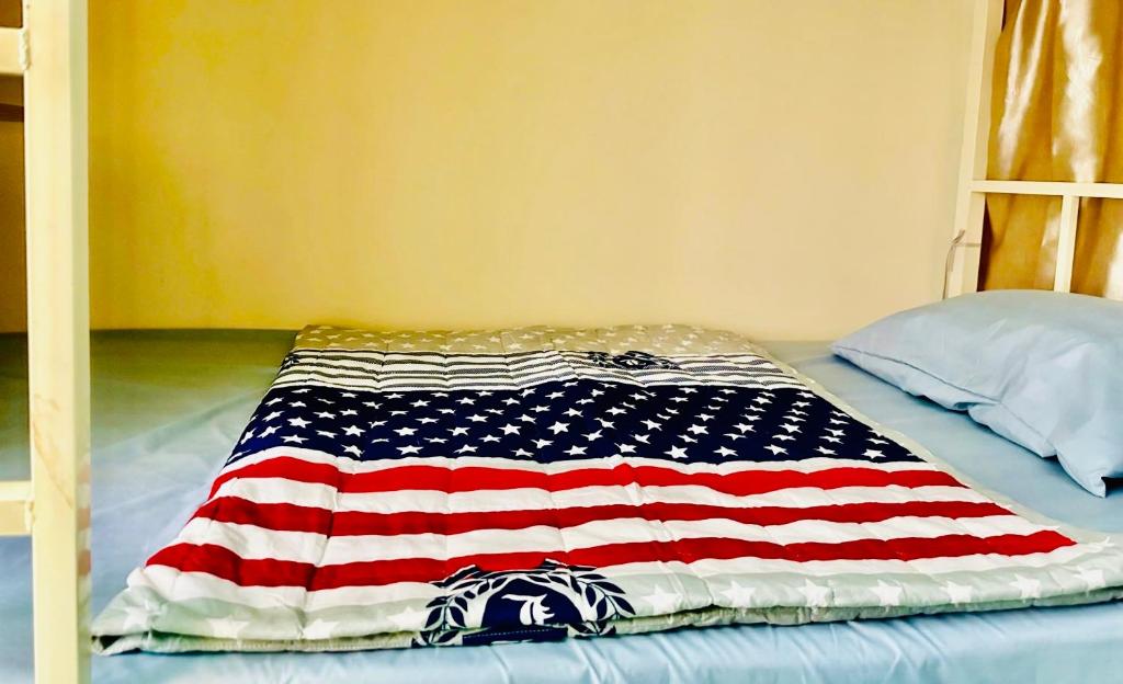 Postel nebo postele na pokoji v ubytování 花Ren Hostel
