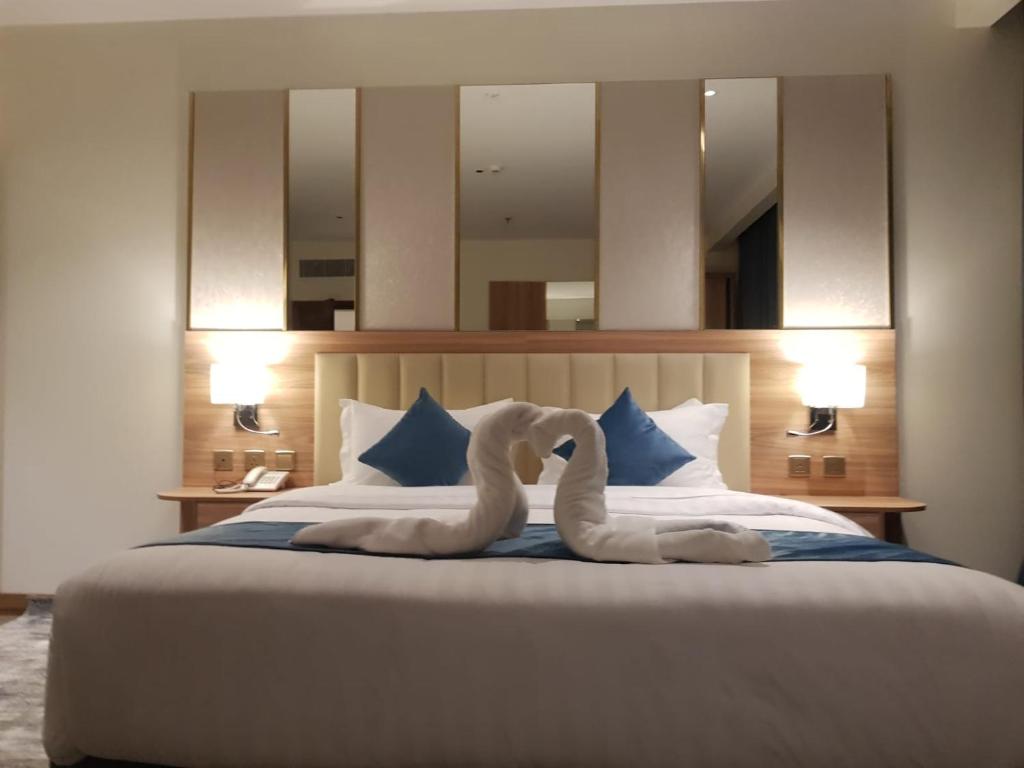 Postel nebo postele na pokoji v ubytování ALHYAT Hotel - فندق الحياة