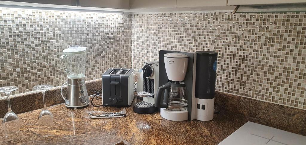 Příslušenství pro přípravu čaje a kávy v ubytování LA VIDA - Duplex on the beach