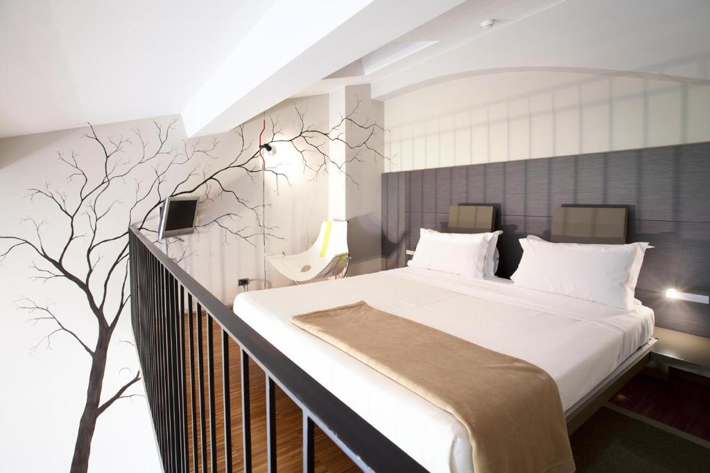 Postel nebo postele na pokoji v ubytování Alter Hotel