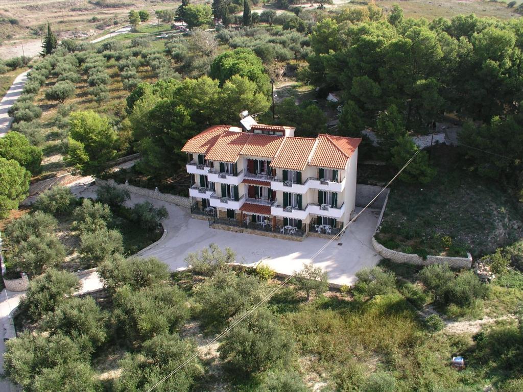 an aerial view of a house with a roof at Almyros Studios & Apartments in Kounopetra