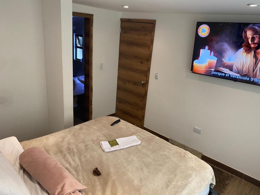 TV a/nebo společenská místnost v ubytování Dulce Hogar Colombiano