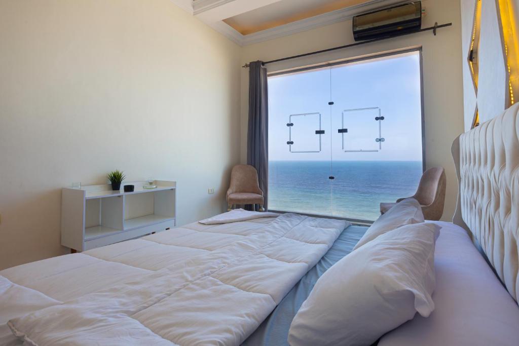 Ένα ή περισσότερα κρεβάτια σε δωμάτιο στο Hyat Suites & Rooms