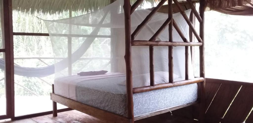 Postel nebo postele na pokoji v ubytování CAMUNGO jungle Lodge in indigenous community ALL INCLUSIVE