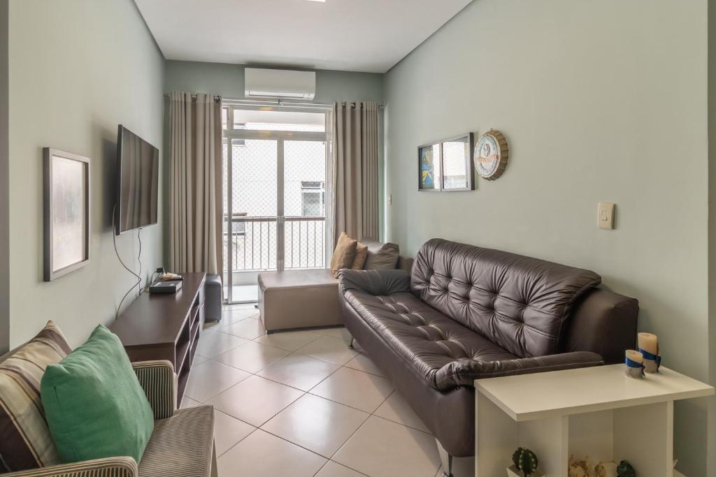 TV a/nebo společenská místnost v ubytování Apartamento Guarujá Praia Tombo