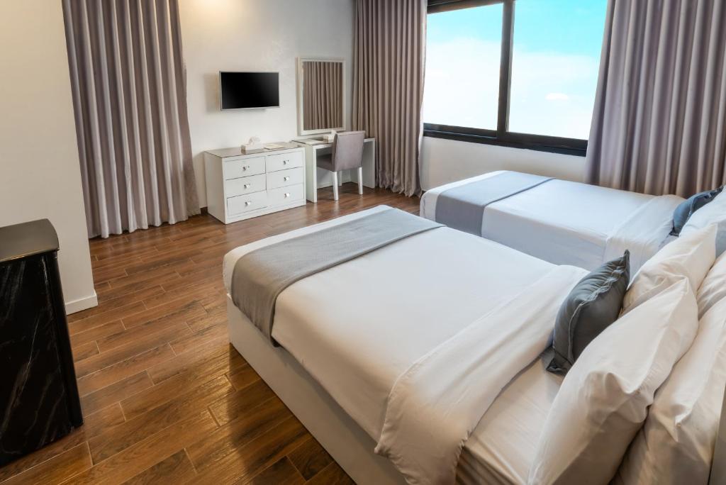 Postel nebo postele na pokoji v ubytování Nile Villa Hotel