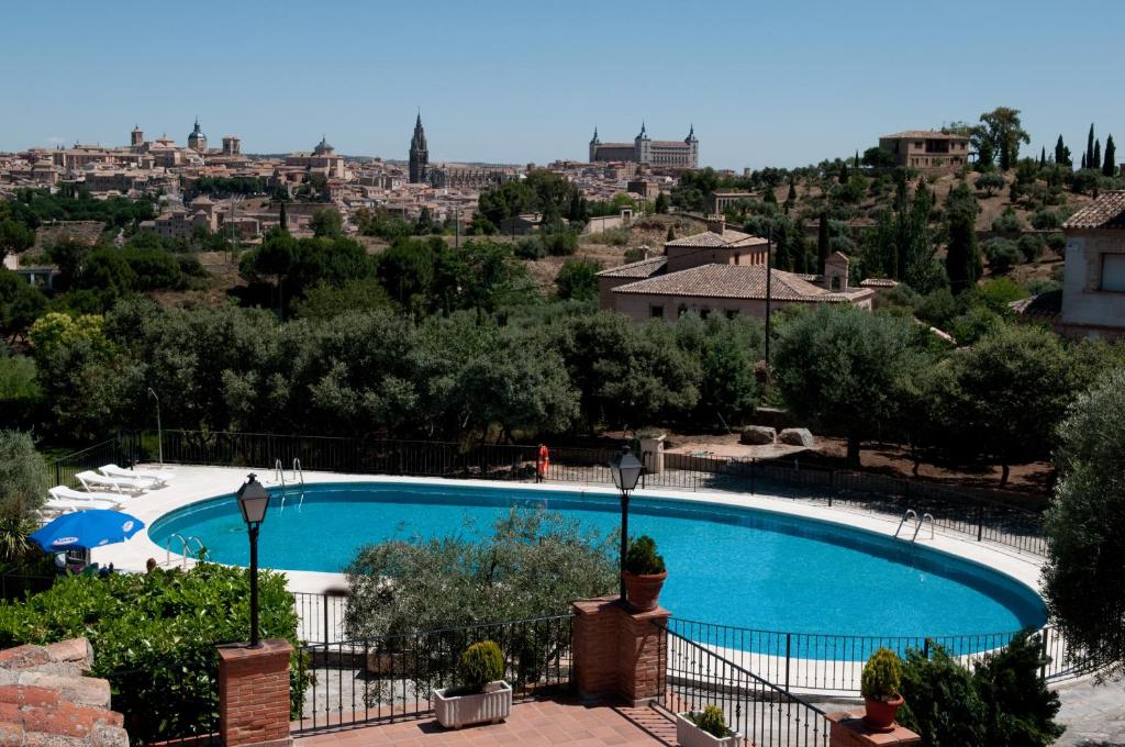 a view of a swimming pool in a resort at Abacería in Toledo