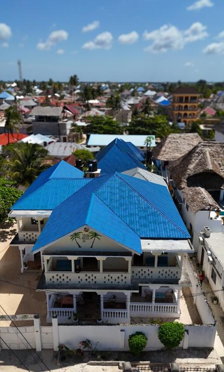 an overhead view of a building with blue roofs at Saba House 24 in Paje