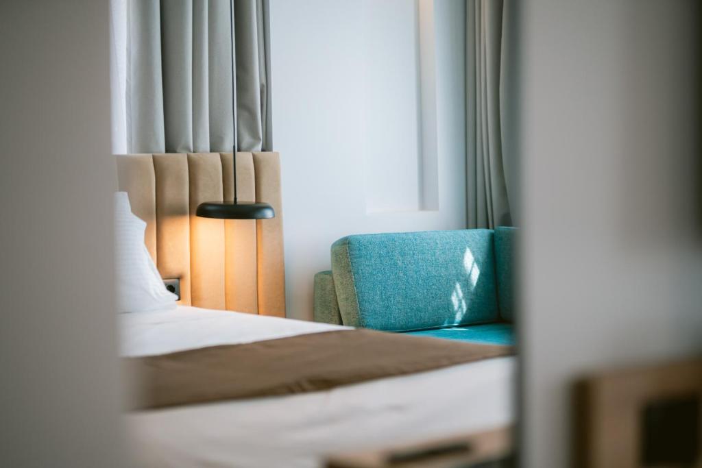 Letto o letti in una camera di TRIBUTE Hotel