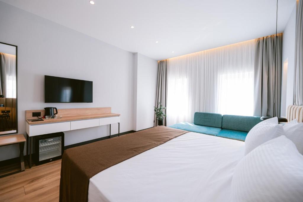 Letto o letti in una camera di TRIBUTE Hotel