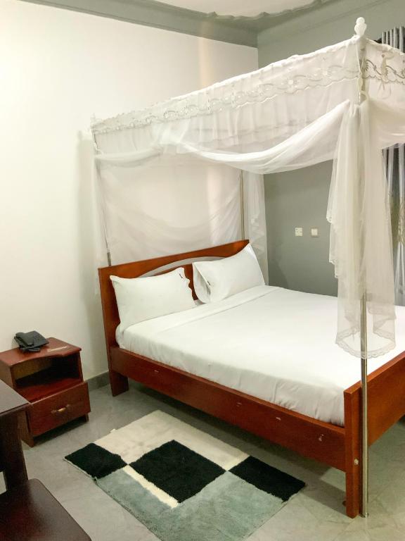 Postel nebo postele na pokoji v ubytování Hendo Hotel