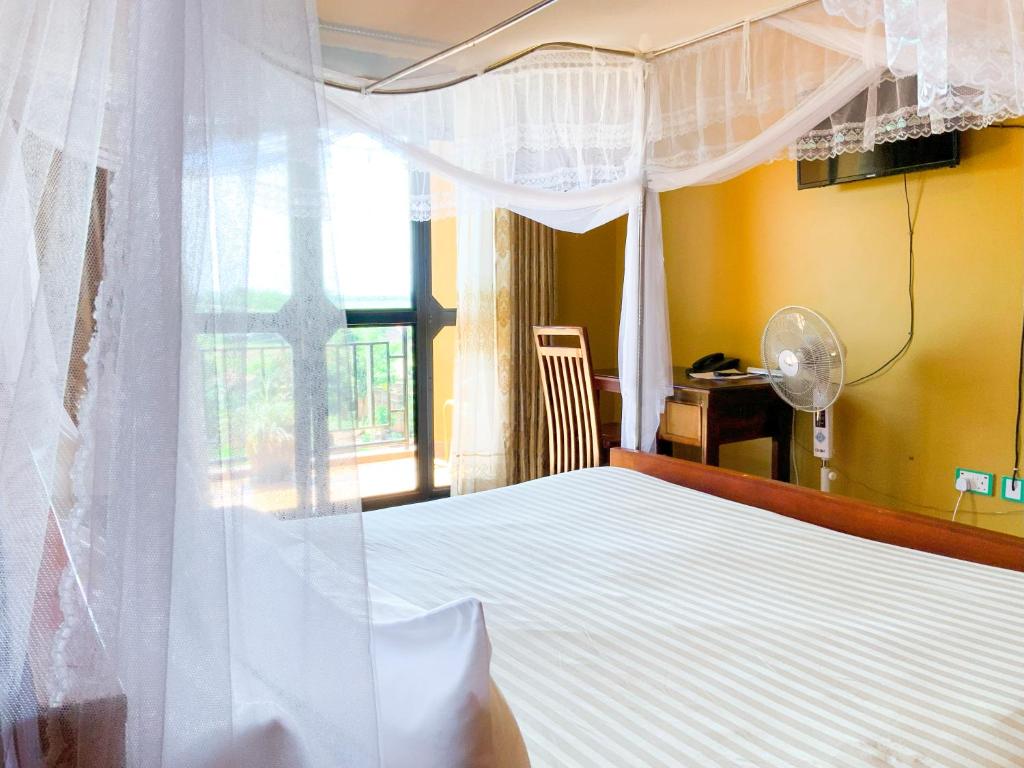 Postel nebo postele na pokoji v ubytování Hendo Hotel