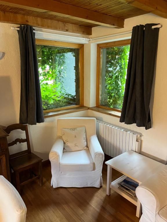 Posezení v ubytování Chalet Blanc Le Duplex