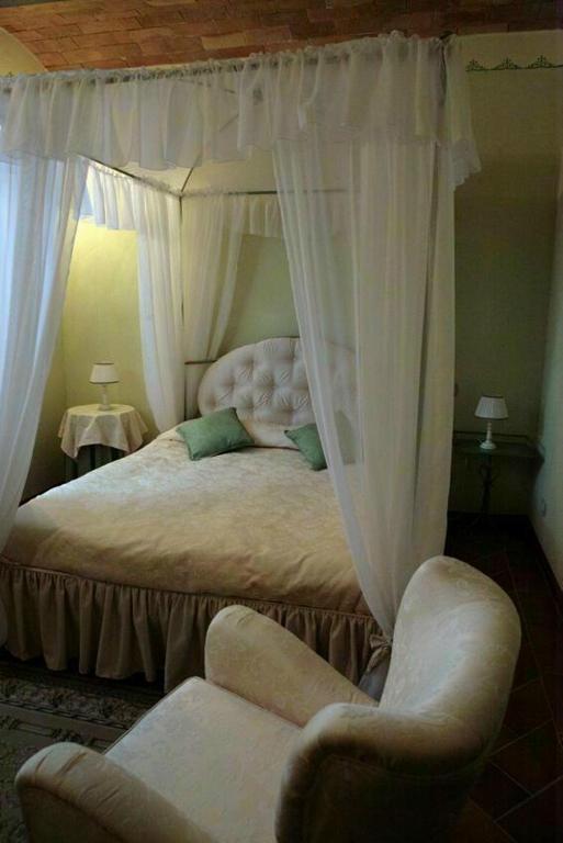 Postel nebo postele na pokoji v ubytování Agriturismo Renaccino