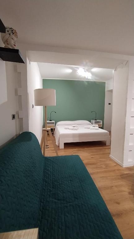 Postel nebo postele na pokoji v ubytování Guest House alla Scala