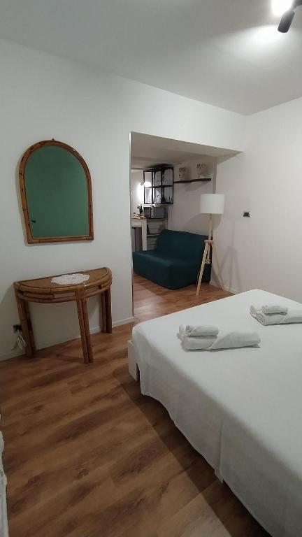 Postel nebo postele na pokoji v ubytování Guest House alla Scala