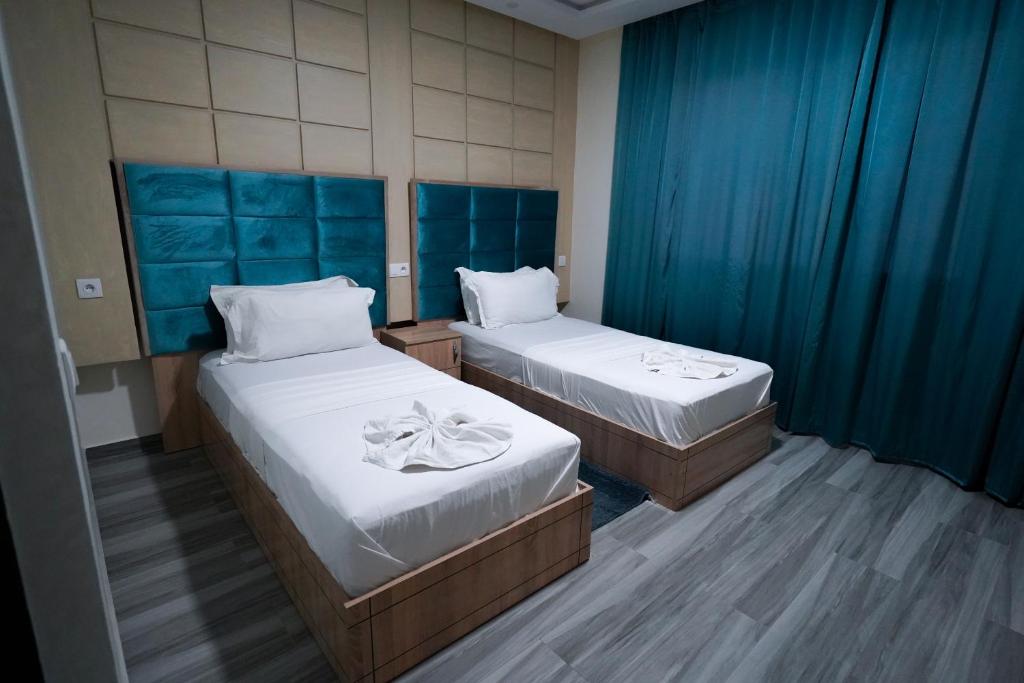 Postel nebo postele na pokoji v ubytování FEKRI HOTEL