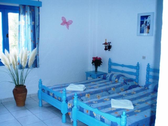 Postel nebo postele na pokoji v ubytování Residence Gerani