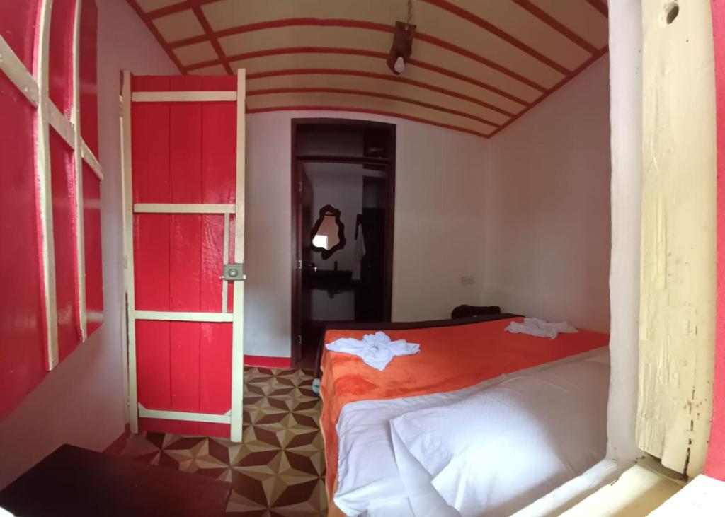 Postel nebo postele na pokoji v ubytování Hostal El Chili