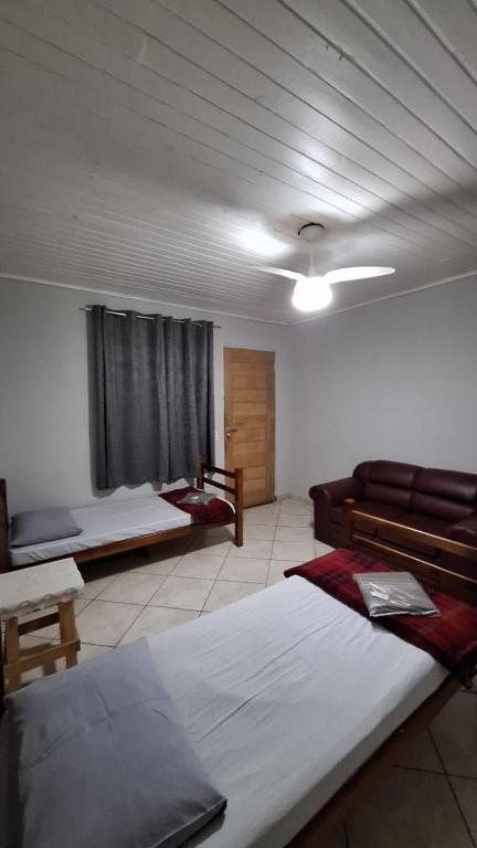 Postel nebo postele na pokoji v ubytování Hostel My House quartos perto do aeroporto de Guarulhos