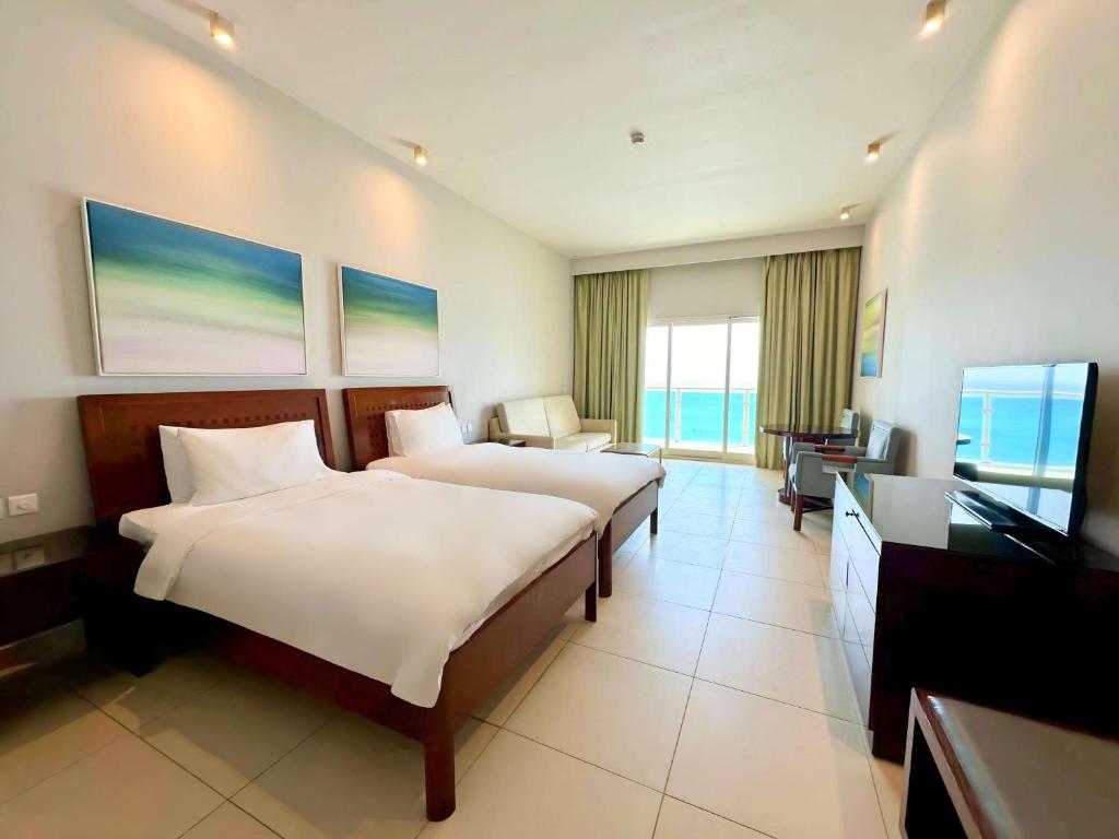 Postel nebo postele na pokoji v ubytování Radisson Blu Resort, Fujairah