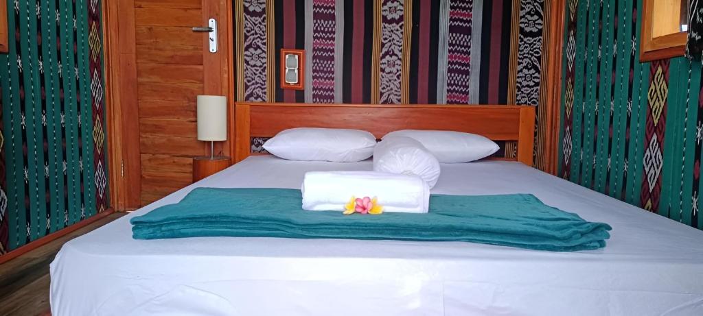 Postel nebo postele na pokoji v ubytování Beach Camp Lombok