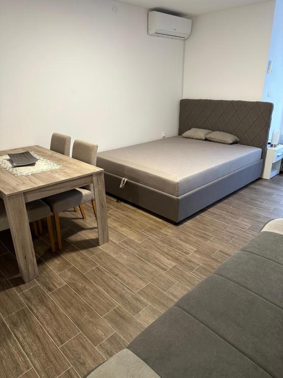 Postel nebo postele na pokoji v ubytování Apartman Milanovic