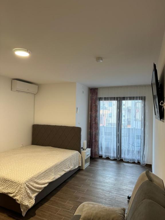 Postel nebo postele na pokoji v ubytování Apartman Milanovic