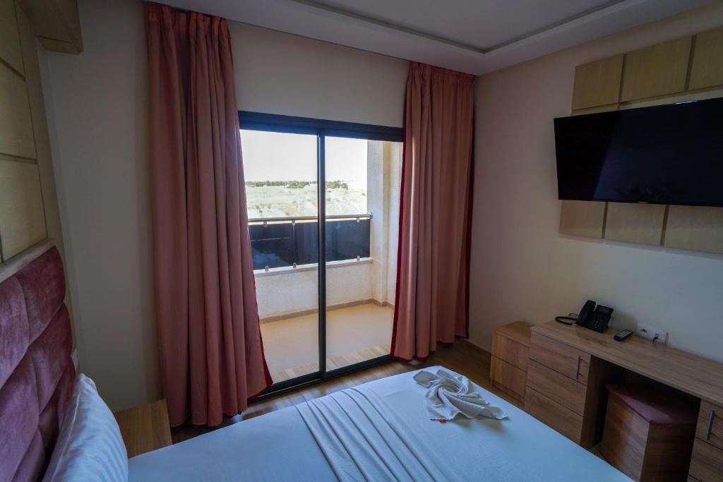 Postel nebo postele na pokoji v ubytování FEKRI HOTEL