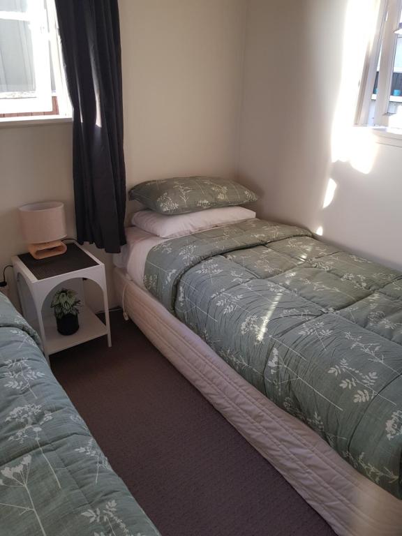 Postel nebo postele na pokoji v ubytování Waitahanui Lodge
