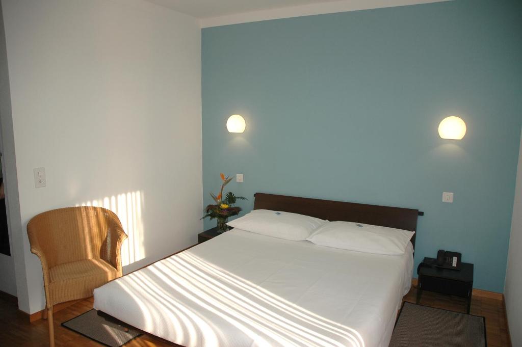 Voodi või voodid majutusasutuse Hotel Pestalozzi Lugano toas