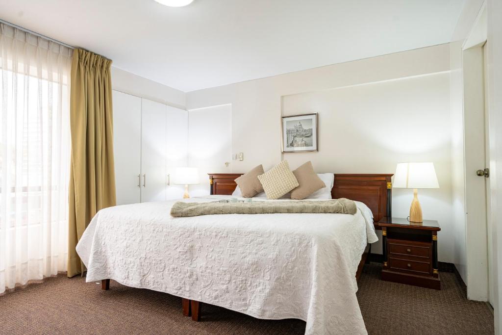 Postel nebo postele na pokoji v ubytování Apart Hotel San Martin