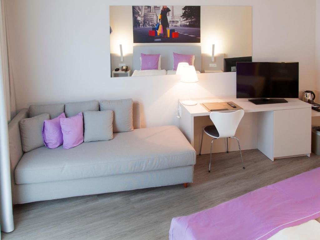 TV a/nebo společenská místnost v ubytování Hotel City Lugano
