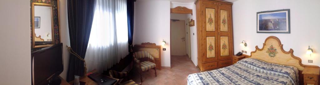 Postel nebo postele na pokoji v ubytování Park Hotel Mater Dei
