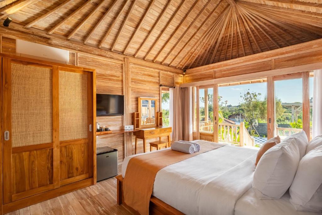 Postel nebo postele na pokoji v ubytování Cove D Ancak Villa and Bungalow