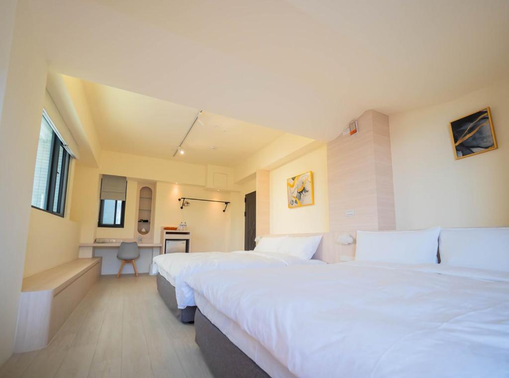 Postel nebo postele na pokoji v ubytování Yin Yun Slow Travel B&B 吟雲慢旅