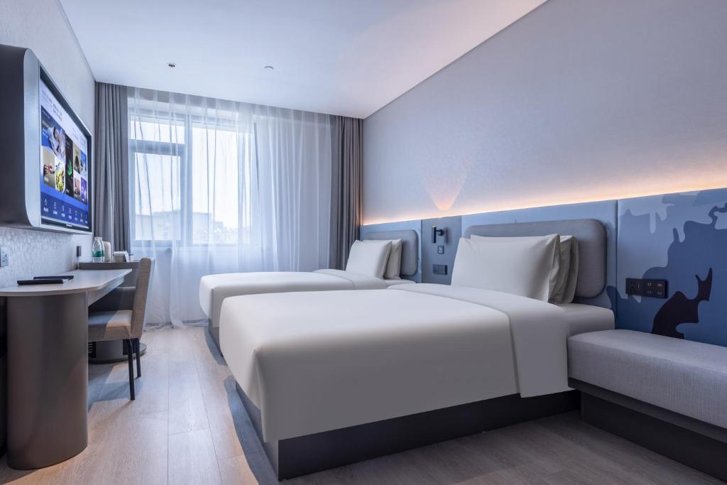 Postel nebo postele na pokoji v ubytování Atour Light Hotel Hefei West Wangjiang Road