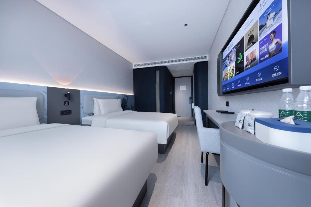Postel nebo postele na pokoji v ubytování Atour Light Hotel Hefei West Wangjiang Road